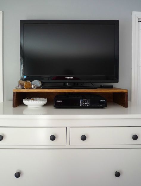 Make a TV stand for the top of your dresser or console to hold cable boxes. Tv Riser On Dresser, Small Tv Stand For Kids Room, Hemnes Dresser Tv Stand, Tv On Top Of Dresser Bedrooms, Bedroom Tv Stand Ideas Dressers, Diy Tv Riser Stand, Diy Tv Riser, Small Tv On Dresser In Bedroom, Dresser As Tv Stand In Bedroom