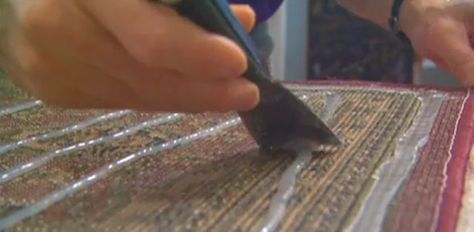 While you could use double stick carpet tape or a nonslip rug pad to keep them from sliding, a simpler solution is to apply a bead of silicone caulking to the bottom of the rug. How To Make Rugs Not Slip, How To Keep Rugs From Slipping, Make A Rug, Putty Knife, Rug Backing, Carpet Tape, Silicone Caulk, Diy Hack, Decorated Wine Glasses