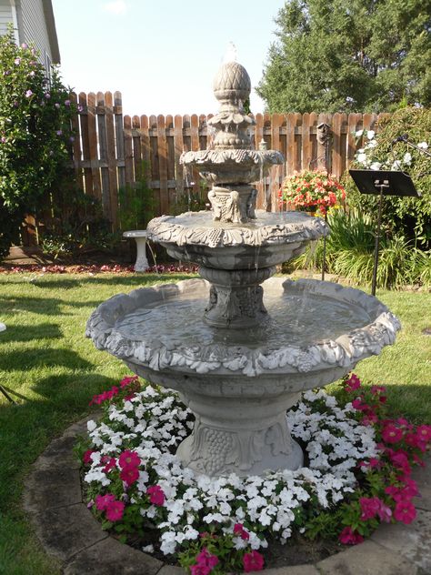 fountain in my yard Fountains Front Yard Water Features, Fountain In Front Yard, Fountain On Patio, Yard Fountains Landscaping, Landscaping Fountain Ideas, Front Yard Landscaping With Fountain, Flowers Around Fountain, Gardens With Fountains, Water Fountain In Garden