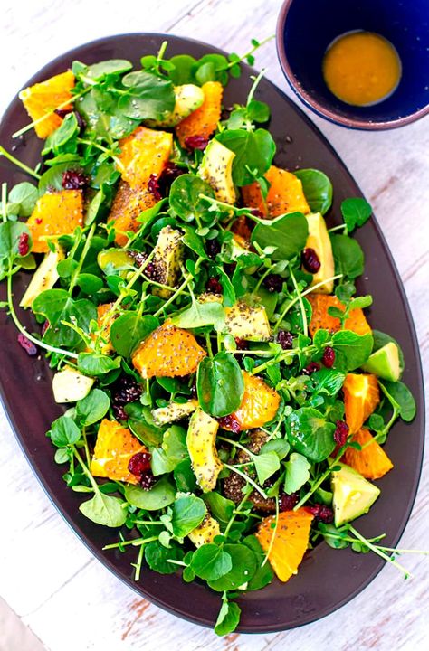 Nutritious and tasty watercress salad with fresh orange and avocado topped with chia seeds and dried cranberries Salad Ideas Vegetarian, Vegetarian Salad Ideas, Salad Recipes High Protein, Work Salads, Raw Veganism, Microgreen Recipes, Salad Master, Watercress Recipes, Edamame Salad