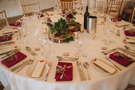 Round wedding tables were decorated with wood slices and pretty flowers with coordinating burgundy napkins at this rustic winter wedding at Sandhole Oak Barn Long Wedding Table Decorations, Burgundy Napkins, Winter Table Setting, Winter Wedding Decor, Round Wedding Tables, Round Table Decor, Tropical Wedding Inspiration, Floral Crown Wedding, Winter Wedding Photos