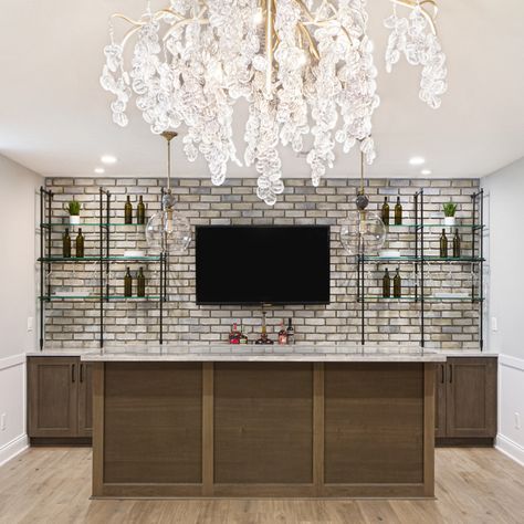 Bar goals achieved! 🍸✨⁠ ⁠ We love how our Bistro Counter to Wall Shelf looks in this beautiful basement bar design. The matte black finish perfectly complements the warm wood tones and ambient lighting.⁠ ⁠ Here's the best part: our shelves are fully customizable! Whether you're working with a cozy nook or a spacious entertainment area, we can fit into any space. We'll tailor the solution from size to finish to your unique needs.⁠ ⁠ Explore more shelving options on our website and let's bring ... Bar And Tv Wall, Basement Corner Bar, Goals Achieved, Bar Corner, Basement Bar Design, Corner Bar, Built In Bar, Entertainment Area, Wood Tones