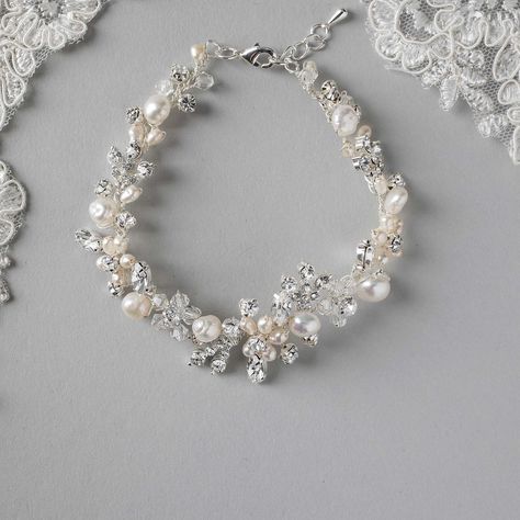 A gorgeous design of hand-wired ivory freshwater pearls, crystal beads, rhinestone accents, and marquise stones! A bracelet perfect for the beach bride or the bride looking for that handmade wedding day element! . #wedding #bracelet #handmade #bridal #cassandralynnebridal #beachwedding #weddingaccessories #bridalaccessories #isaidyes #wesaidyes #gettingmarried #pearlbracelet Bride Bracelet, Hippie Bracelets, Beach Bride, Adjustable Jewelry, Swarovski Crystal Beads, Wedding Jewelry Bracelets, Bridal Bracelet, Beads Handmade, Wedding Jewelry Sets