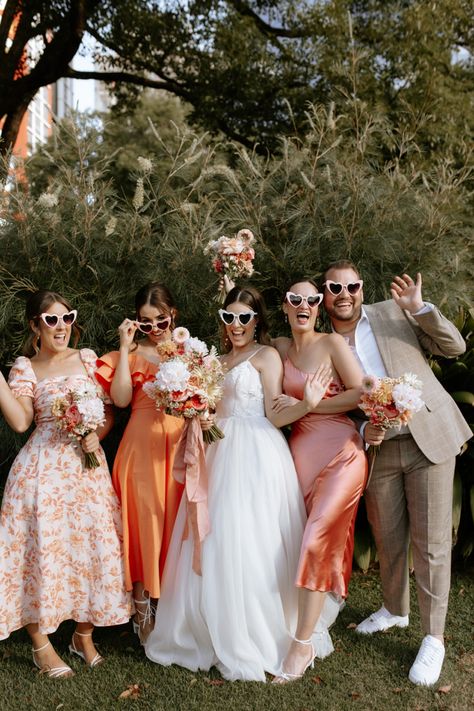 Desert Pastel Wedding, Pastel Wedding Party, Floral Peach Dress, Pink Bridal Party, Beige Bridesmaids, Orange And Pink Wedding, Peach Bridesmaid, Bridal Parties Colors, Peach Bridesmaid Dresses