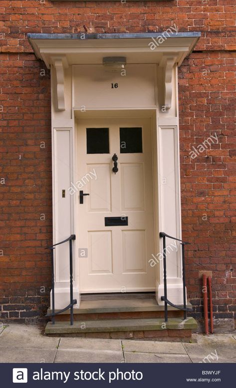 Download this stock image: Cream coloured part glazed front door with canopy of townhouse in Ludlow Shropshire England UK - B3WYJF from Alamy's library of millions of high resolution stock photos, illustrations and vectors. Front Door With Canopy, Cream Front Door, Cottage Exterior Colors, Porch Overhang, Front Door Canopy, Front Door Lighting, Front Door Steps, Cotswolds England, Porch Roof