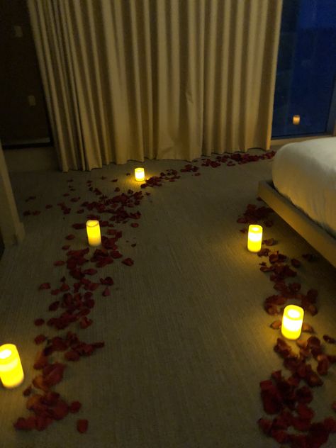 The romantic hotel room decoration with real rose petals, candles and flowers. We also serve cool champagne and strawberries covered with chocolate. Package "Room makeover for $300" Wedding Night Bedroom, Honeymoon Rooms, Hotel Room Decoration, Romantic Hotel Rooms, Wedding Night Room Decorations, Rose Petal Candle, Romantic Room Surprise, Romantic Room Decoration, Bedroom Candles