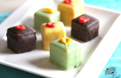 Petit Fours are a delightful addition to any holiday gathering, and are so simple to change up to suit the season.  Try chocolate with raspberry, lemon, blueberry, vanilla, or peach filling…the possibilities are endless! Easy Petit Fours, Southern Praline Cake, Petit Four Recipes, Peach Filling, Petite Fours, Poetry Tea, Apple Crumb Cakes, Blueberry Filling, Dessert Mini