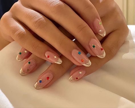 Nail Jewels Simple, Eras Tour Nails Bejeweled, Bejeweled French Tips, Colorful Gems Nails, Gold French Tip Nails With Gems, Nails With Colored Rhinestones, French Nails With Rhinestones Diamonds, Colored Rhinestone Nails, Eras Tour Nails French Tips