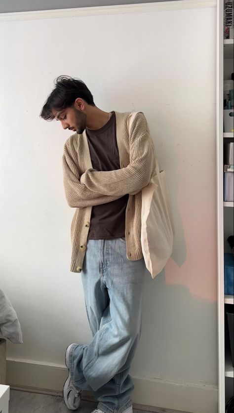 beige cardigan, brown uniqlo t-shirt, light blue baggy jeans, new balance 530 trainers Guys In Cardigans, Men In Cardigans Aesthetic, How To Style A Cardigan Men, Guy Cardigan Outfits, Tan Jeans Outfit Men, Beige Cardigan Outfit Men, Soft Men Aesthetic, Cardigan Fits Men, Men Cardigan Outfit Aesthetic