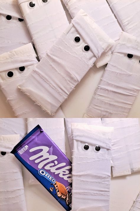 Halloween white Mummy wrapped Chocolate bars for children! These creative candy for kids are an awesome trick or treat candy idea for your party! What you get: Each mummy consists of a Milka chocolate bar wrapped with white ribbons. Wiggly eyes are then added to the outer packaging The chocolate bar is unopened and wrapped while still being in its original packaging. Each Milka chocolate bar weighs 100g #halloween #halloweencandy #mummy #creativecandy #sweetsforkids #kidssnacks #chocolatebars Full Size Candy Bars Halloween Ideas, Halloween Candy Wrapping Ideas, Wrapped Chocolate Bars, Mummy Treats, Halloween Candy Bar, Milka Chocolate, Chocolate Bar Wrapping, Trick Or Treat Candy, Halloween Creative