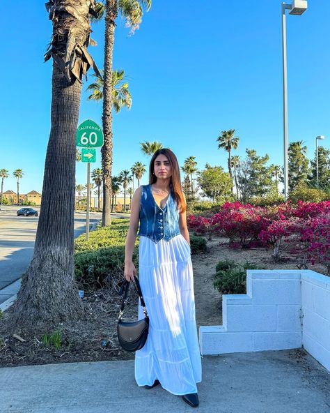 White maxi skirt & denim vest 🤍 Wearing my favourite denim vest from @freepeople Comment “LINK” and I’ll DM you 🫶🏻 Denim vest- @freepeople Maxi skirt- @hollister Bag- @jwpei_official Boots- @hm #summeroutfit #maxiskirt #denimvest #outfitoftheday #summerfashion Maxi Skirt Denim, White Maxi Skirt, White Maxi Skirts, Instagram White, Skirt Denim, White Maxi, Maxi Skirts, Denim Vest, My Favourite