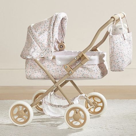 Outings with their precious cargo get a pretty upgrade with this adorable doll pram. The sturdy iron design is set on rolling wheels and features an intricate filigree fabric and matching bag for strolling in style. DETAILS THAT MATTER Made of plastic and metal. Handle is made of iron tube. Fabric is made of 100% polyester print. Wheels are made of foam. Wheels swivel. Stroller is foldable. KEY PRODUCT POINTS Pottery Barn Kids exclusive. Recommended for ages 3 and older. Wipe clean. Imported. SAFETY INFORMATION WARNING: CHOKING HAZARD - Click for details. Reborn Accessories, Doll Pram, Convertible Stroller, Dog Accesories, Newborn Mom, Iron Design, Pram Stroller, Stroller Toys