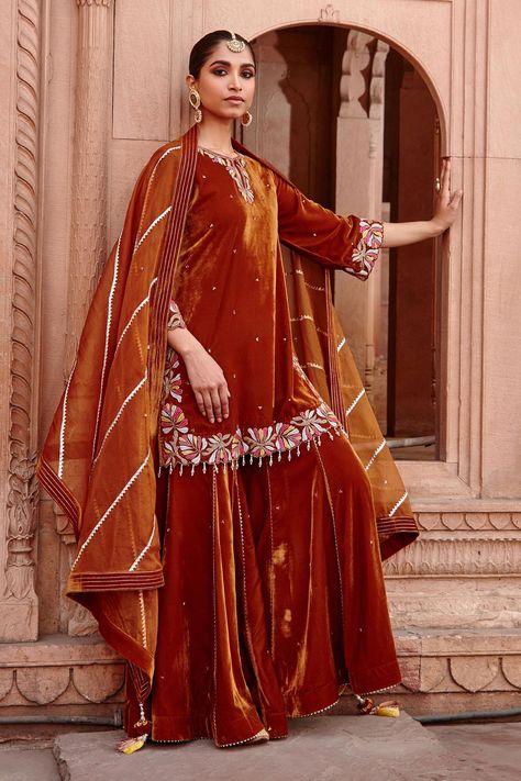 Buy Ajiesh Oberoi Gold Velvet Keyhole Neck Kurta Gharara Set Online | Aza Fashions Velvet Gharara Designs, Tassel Dupatta, Gharara Designs, Velvet Kurta, Velvet Lehenga, Pink Kurta, Short Kurta, Desi Wear, Pakistani Fancy Dresses