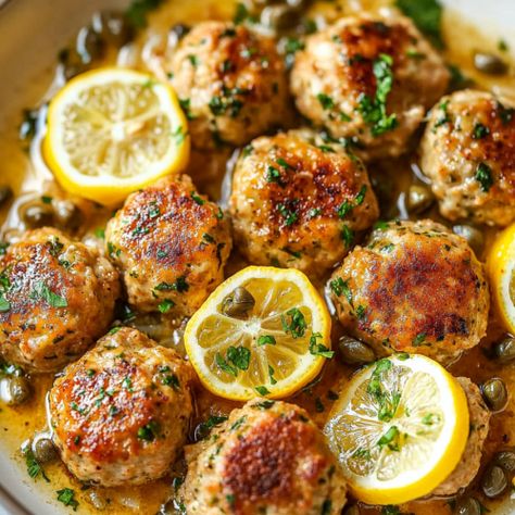 Lemon chicken piccata meatballs Lemon Garlic Chicken Meatballs, Greek Chicken Meatballs In Lemon Cream Sauce, Lemon Garlic Meatballs, Giada De Laurentiis Chicken Piccata Meatballs, Giada Chicken Piccata Meatballs, Shredded Chicken Meatballs, Chicken Picatta Meatballs Allrecipes, Lemon Chicken Meatballs, Mediterranean Chicken Meatballs