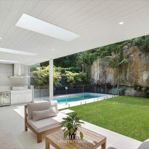 The perfect outdoor entertaining space in Mosman: lush green grass, outdoor kitchen and seating area, tropical landscaping and, of course, a Blue Haven Pool.

📸  by Mert Property Images Outdoor Entertaining Area Pool, Pool Entertainment Area, Modern Queenslander, Garden Pool Design, Outdoor Entertainment Area, Blue Haven Pools, Living Pool, Open House Plans, Entertaining Space