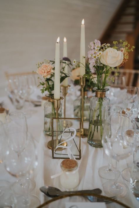 Neutral Wedding Round Table Decor, Glass Candle Sticks Wedding, Candle Sticks And Bud Vases, Bud Vases Wedding Centerpiece Round Table Setting, Wedding Centerpieces Candlesticks, Flowers In Bud Vases, Wedding Dress Pastel, Round Table Centerpieces, London Wedding Dress