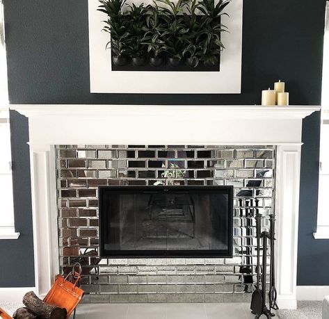 Mirrored subway tiles on fireplace Glass Tile Fireplace, Subway Tile Fireplace, Stove Ideas, Mirror Tile, Tile Fireplace, Fireplace Tile Surround, Brick Fireplace Makeover, Fireplace Mirror, Exterior Makeover