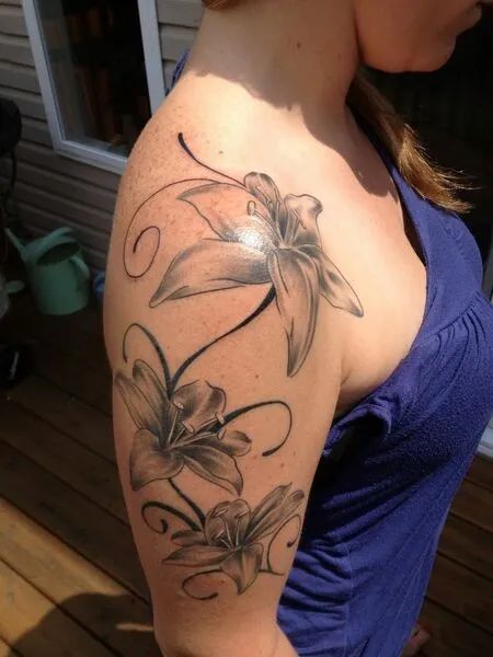 Shoulder Lily Tattoo Lily Flower Tattoos Sleeve Women, Lily Tattoo On Arm, Black Orchid Tattoo, Lily Tattoo Sleeve, Black Lilies, Lily Tattoo Meaning, Tiger Lily Tattoos, Lily Tattoos, Water Lily Tattoos