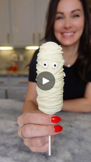 127K views · 12K reactions | Frozen Banana Mummies. Follow @chefgenevieve for 50 Halloween inspired Recipes #halloweenfood #halloweeninspo #frozenbananas #bananamummy

Frozen Banana Mummy Pops
Makes 6

Ingredients:
3 bananas, halved
12oz white coating wafers
12 candy eyeballs
6 candy sticks 

Directions: 

Peel bananas, then cut in half. Add in a candy stick through, into the cut side. Freeze on parchment paper (2-3 hours)

Melt white coating wafers according to package directions. Dip frozen bananas in, then allow to try on parchment paper.

Transfer remaining melted chocolate into a Ziploc or piping bag. Snip a small amount off the tip. Use to glue on candy eyeballs and to drizzle all over the banana (make sure not to cover the eyeballs)

Keep frozen until ready to use

Enjoy!! 👻 | Gene Banana Mummies, Candy Wafers, Candy Stick, Chocolate Covered Bananas, Candy Eyeballs, Brownie Cups, Frozen Bananas, Popcorn Bar, Candy Sticks