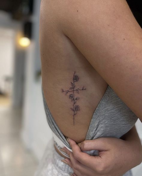 Cross Side Tattoo Ribs, Feminine Biblical Tattoos, Cross Tattoo Placement For Women, Vine Cross Tattoo, Cross Sternum Tattoo Women, Rib Cross Tattoo, Tattoo Cross With Flowers, Cross Sternum Tattoo, Men’s Tatoos