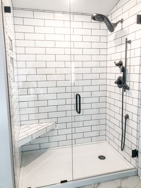 Subway tile shower. Walk In Shower White Subway Tile, 4x12 Subway Tile Bathroom, Small Minimal Bathroom, Black And White Tile Shower Ideas, White Subway Tile Bathroom Shower Modern Farmhouse, White Subway Tile Shower Dark Grout, White Subway Tile Black Fixtures, White Subway Tile Shower With Black Hardware, Stand Up Showers