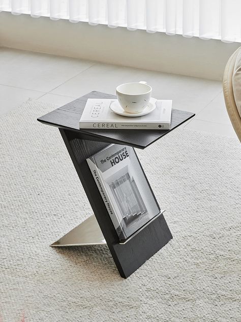 Enhance your home decor with our Z Shaped Solid Wood End Table. This elegant piece features a unique Z-shaped design, combining functionality with a modern aesthetic. Made from high-quality solid wood, it offers durability and a natural look that complements any space. Perfect for living rooms, bedrooms, or offices, this end table is ideal for holding beverages, books, or decorative items. Specifications Size: L30*W40*H46cm Material: PE Plastic Features Unique Design: Modern Z-shaped design adds a contemporary touch to any room. Solid Wood Construction: Crafted from high-quality solid wood for durability and a natural look. Versatile Use: Ideal for living rooms, bedrooms, offices, or as a stylish accent table. Functional Surface: Perfect for holding drinks, books, lamps, or decorative item Cart Coffee Table, Sofa Corner, Kitchen Cups, Wood End Table, Magazine Holder, Black Side Table, Small Coffee Table, Wood End Tables, Solid Wood Table