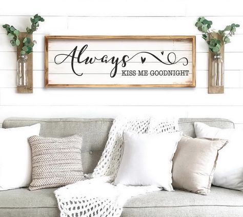 PRICES MAY VARY. Elevate Bedroom Decor: Add a touch of romance with this "Always Kiss Me Goodnight" wall sign. Crafted with a solid wood frame, it complements farmhouse aesthetics, enhancing your bedroom's ambiance. It's perfect for above-bed placement with some small decoration on both side. Love-Centric Design: Measuring 27.5"W x 9.5"H, this charming decor piece is perfect for couples seeking an endearing focal point above their bed. Its love-themed motif creates a warm, inviting atmosphere. P Always Kiss Me Goodnight Sign Above Bed, Together Is Our Favorite Place To Be, Home Signs Wooden, Bedroom Wall Decor Ideas Above Bed, Farmhouse Wall Decor Living Room, Bedroom Art Above Bed, Farmhouse Living Room Wall Decor, Bed Placement, Wall Decor For Kitchen