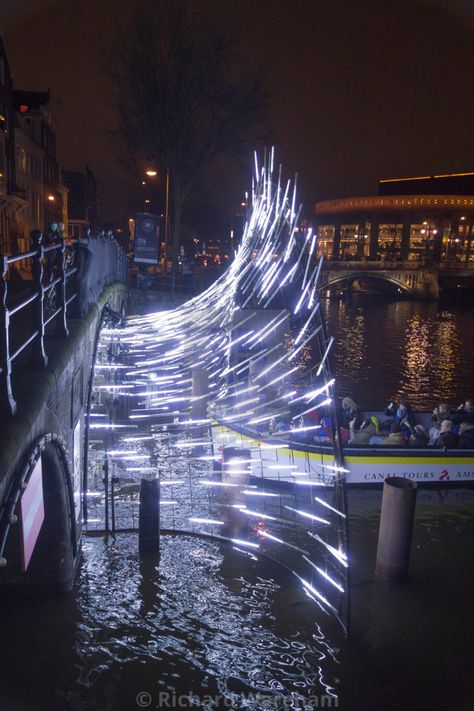 "Amsterdam The Netherlands Amsterdam Light Festival. A canal boat passes through a light installation at the entrance to the Herengracht canal." by Richard Wareham - US$112.46 Festival Entrance, Venue Entrance, Light Sculpture Installation, Lighting Festival, Amsterdam Light Festival, Led Installation, Led Light Installation, Festival Of Light, Light Structure