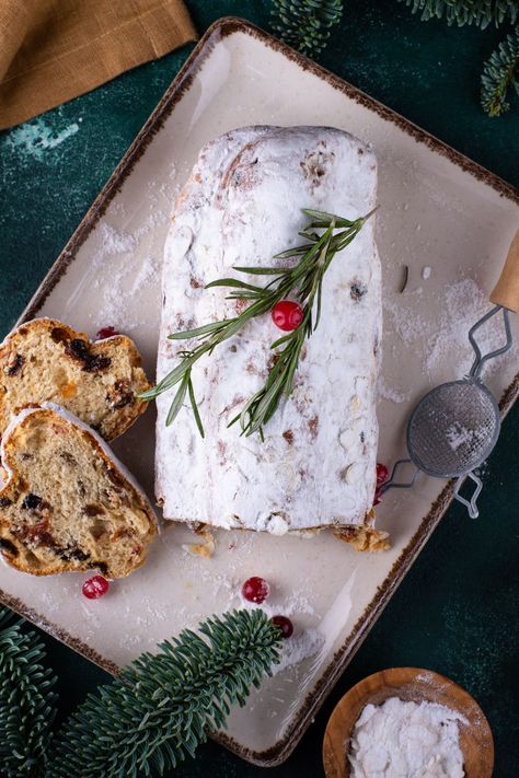 New Year German Stollen Cake recipe made of dried fruits, nuts, spices, and marzipan, all coated in powdered sugar serves 12 and takes about 1 hour to prepare Marzipan Fruit Cake, Marzipan Stollen, Stollen Cake, German Stollen, Christmas Stollen, Marzipan Fruit, Crust Designs, Pie Crust Designs, Fruity Desserts