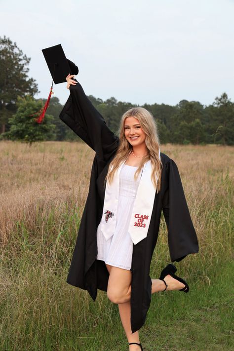 field, cap and gown, grad gown, diploma, grad pics, graduation, high school graduate, senior pics, senior photos, senior field pics, 2023, 2023 grad pics, 2024 grad pics, graduation, graduation dress, grad dress, white dress Grad Pics With Cap And Gown, Graduation Pictures With Diploma, Cape And Gown Senior Pictures, Girl Cap And Gown, Field Graduation Photos, Senior Photos Cap And Gown, Cap Gown Photos, Senior Graduation Pictures High Schools, Senior Picture Ideas Cap And Gown