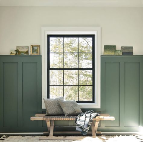 Entryway with white walls and green wainscoting, featuring a wooden bench in front of large window with black trim. Interior Paint Colors Benjamin Moore, Craftsman Interior Paint Colors, Craftsman Paint Colors, Painted Wainscoting, Green Accent Walls, Craftsman Interior, Paint Colors Benjamin Moore, Green Paint Colors, Green Walls