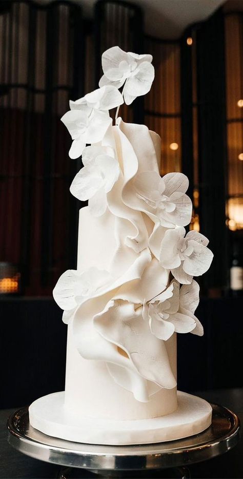 Unique White Wedding Cakes, Wedding Cakes Orchids, Avant Garde Wedding Cake, White Orchid Wedding Cake, Draped Wedding Cake, Sculptural Wedding Cake, Orchid Cake Wedding, Modern Wedding Style, Big Wedding Cakes Elegant