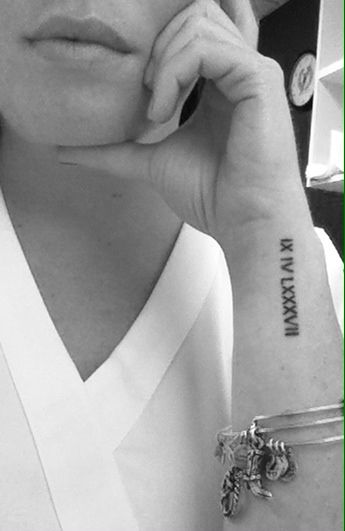 Wrist Roman numeral tattoo Roman Numeral Wrist Tattoo, Birthdate Tattoo, A Small Tattoo, Roman Numeral Tattoos, Cool Wrist Tattoos, Date Tattoos, Wrist Tattoos For Guys, Small Wrist Tattoos, Wrist Tattoos For Women