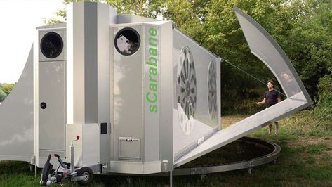 When traveling, the sCarabane is a boxy mobile garage, but once you’re at camp, the trailer unfolds to reveal a spacious, 420-square-foot tiny house. Two Bedroom Tiny House, Mobile Garage, Small Washing Machine, Two Twin Beds, Outdoor Kitchen Appliances, Green Cat, Front Deck, Casa Container, Solar Cell