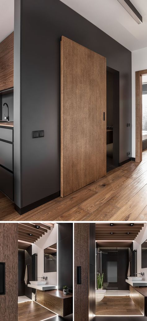 A sliding wood door defines this modern bathroom, while hidden lighting has been used in the floor, creating a soft glow and lighting up the mostly dark room. The white tiles help to reflect the light throughout the space. Utility Sliding Doors, Hidden Toilet Door, Sliding Toilet Door, Grey And Brown Kitchen, Doors Colors, Masculine Apartment, Apartemen Studio, Sliding Wood Doors, Hidden Lighting