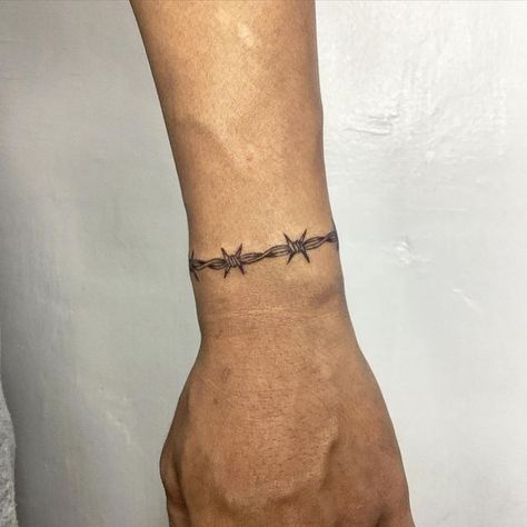 Resh Tattoo on Instagram: "Wrist barb wire band. ⛓️  #wristtattoo  #bandtattoo #barbwire #inked #tattoo" Wrist Tattoos Barbed Wire, X Finger Tattoo, Tattoo Wire Barbed, Barbwire Bracelet Tattoo, Barb Wire Bracelet Tattoo, Barbed Wire Tattoo Forearm, Small Barbed Wire Tattoo, Barbed Wire Tattoo Sleeve, Barbed Wire Band Tattoo