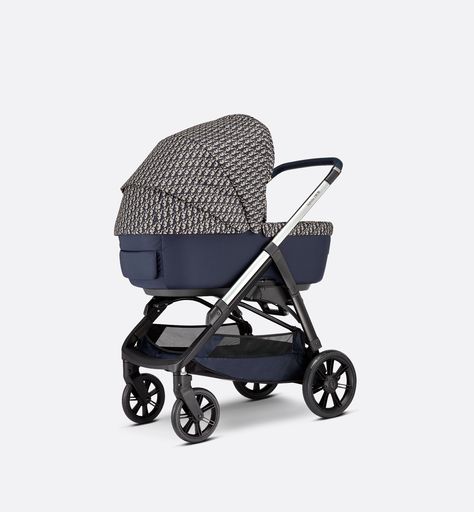 The Baby Dior collection is expanding with a combo created in collaboration with Inglesina. Combining excellence, functionality and timeless elegance, its design features a versatile frame that can accommodate either a bassinet or stroller, making it the ideal companion for the first years of any child's growth. Dior's art of detail can be observed on the Dior signature wheels and leather handle. Its dimensions and 360° front wheels make it compact, maneuverable and adjustable, and it can be eas Designer Strollers, Luxury Stroller, Baby Dior, Blanket Poncho, Dior Collection, Sun And Rain, Dior Oblique, Luxury Baby, Baby Stroller