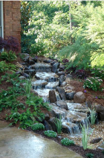 37 Backyard Garden Waterfall Ideas - | Sebring Design Build Backyard Stream, Small Garden Waterfalls, Waterfall Landscaping, Garden Stream, Pondless Water Features, Outdoor Waterfalls, Outdoor Water Features, Fountains Backyard, Diy Garden Fountains