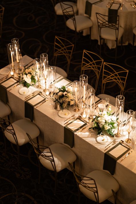 Elegant trios of floral arrangements and gold candlesticks with taper candles along the length of a long guest table. PC: Ann Coen https://www.anncoen.com/photography Long Table Wedding Decor Candles, Tall Wedding Centerpieces Long Table, Gold Taper Candles Wedding, Tall Candle Centerpieces Wedding Long Table, Wedding Centerpiece Candlestick, Floral And Candle Table Decor, Taper Candle Centerpiece Wedding Long Table, Candle Placement Ideas, Taper Candle Centerpiece Wedding Round Table