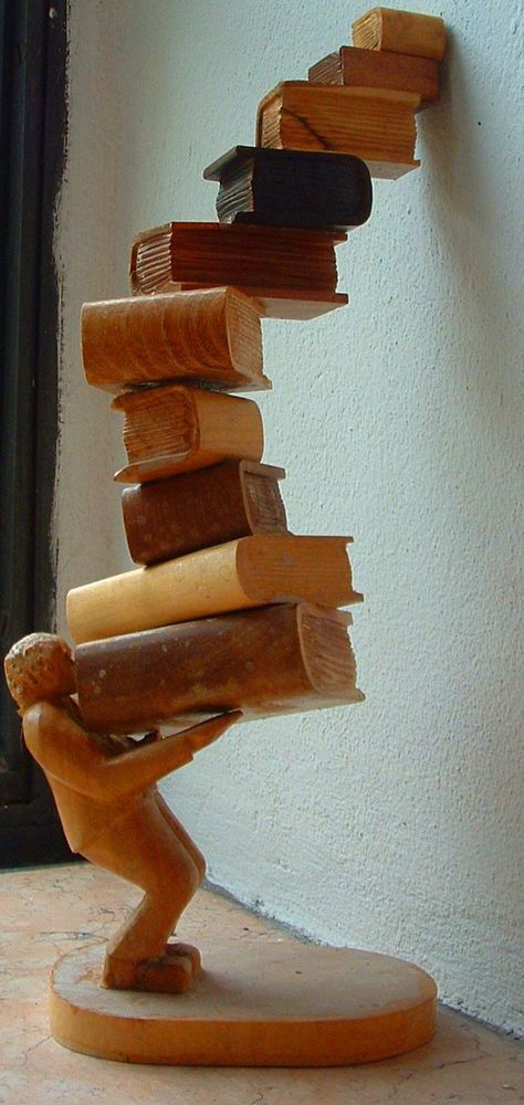 A wood statue of a reader—does this remind you of your last visit to a bookstore or library? #literaryart http://writersrelief.com/ Wooden Artwork, Book Sculpture, Wooden Statues, World Of Books, Stack Of Books, Objet D'art, Old Books, Library Books, I Love Books