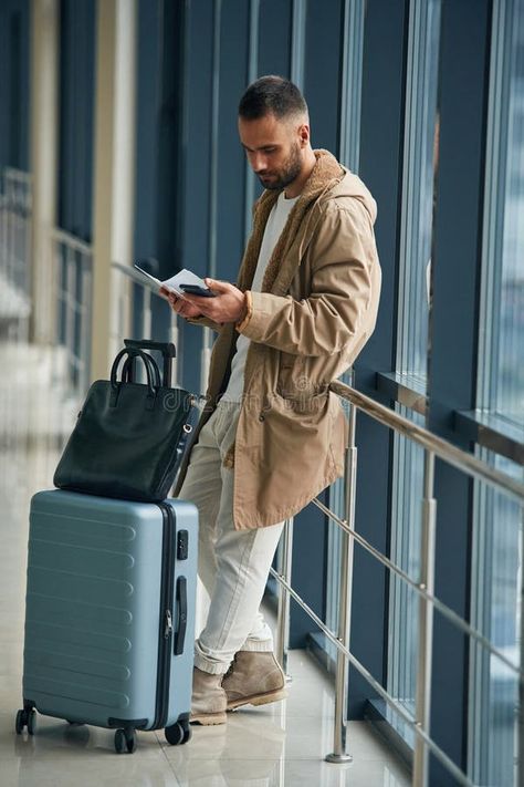 Smartphone in hands. Young handsome man in the airport royalty free stock photography Airport Poses For Men, Airport Photography, Celebrity Film, Travel Photoshoot, In The Airport, Happy Images, Airport Travel, Mens Editorial, Romantic Scenes