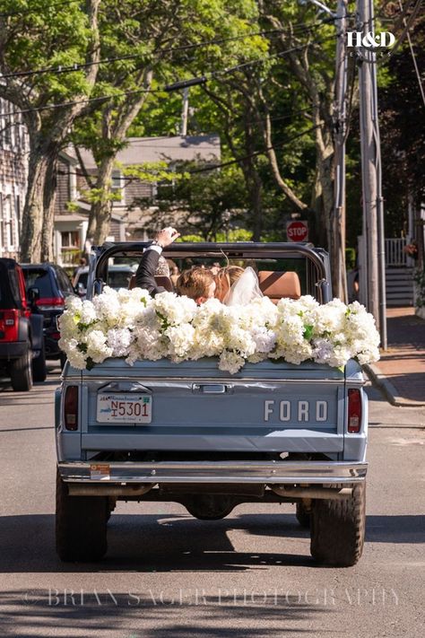 Drive away from your wedding ceremony in style with floral wedding car decorations. Delicate and understated, white flowers are a simple way to bring elegance to the "Just Married" getaway car design. See more photos from Katie & Hugh's luxury wedding. Wedding Getaway Car, Getaway Wedding, Elegant Floral Wedding, Just Married Car, Jackson Hole Wedding, Wedding Car Decorations, Wedding Send Off, White Wedding Theme, Car Decorations