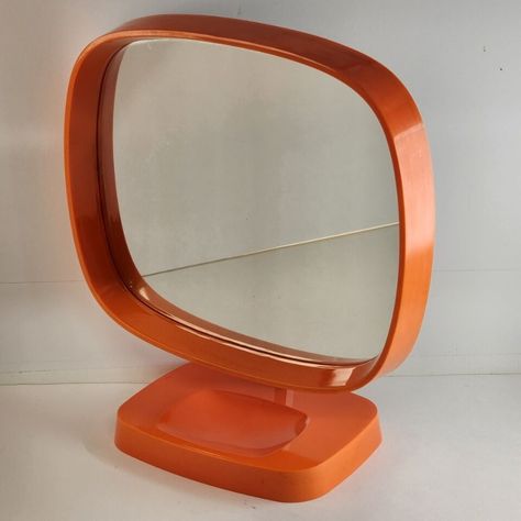 1960's Danish Mod Dresser Top Mirror, Groovy Man! 
Imagine a mirror that doesn’t just reflect your image but also the vibrant spirit of the '60s. 
This Mirror is yearning to bring its Flower Power Orange zest back into someone’s life. This isn’t just a piece of decor; it’s a portal to a groovy era, missing the gaze of someone who appreciates its uniqueness. 
This and other vanity mirrors can be found in our eBay store!🌼🧡 

 #Mirror #VanityMirror #MakeupMirror  #ArtDeco Orange Danish, Cake Makeover, 70s Mirror, Orange Stuff, 60s Decor, Mirror Dresser, Mid Century Mirror, Plastic Mirror, Pinterest Contest