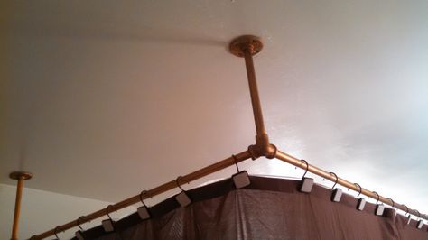 When we moved in, the shower curtain rod consisted of a homemade-looking D-shaped contraption. It seemed like a great shape, but we immediately realized that the D shape combined with the tub&#8217… Brass Shower Curtain Rod, Tub To Shower Remodel, Shower Remodel Diy, Small Shower Remodel, Diy Curtain Rods, Diy Shower Curtain, Diy Curtain, Basement Remodel Diy, Fiberglass Shower