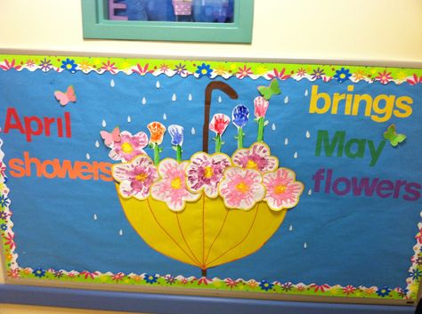 April/may bulletin board. Flowers made by hand prints. April Bulletin Board Ideas, April Bulletin Boards, Easter Bulletin Boards, Door Bulletin Boards, Work Bulletin Boards, Spring Bulletin, April Crafts, Spring Bulletin Boards, Preschool Bulletin