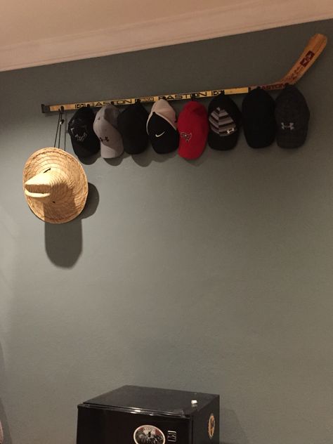 Hat rack - old hockey stick makes a good one.                                                                                                                                                      More                                                                                                                                                                                 More Hat Rack Diy, Display Rack Ideas, Hat Rack Ideas, Boys Christmas Gifts, Wall Hat Racks, Baseball Hat Racks, Diy Hat Rack, Cowboy Hat Rack, Hat Shelf