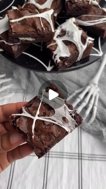 Pillsbury Baking on Instagram: "Easy spider web brownies in just a few simple steps!🕷⁠
⁠
Save this to create these sweet webs yourself!🕸⁠
⁠
What you’ll need:⁠
1 box of Pillsbury Chocolate Fudge Brownie Mix⁠
Additional ingredients according to box instructions⁠
Marshmallows⁠
Chocolate sandwich cookies⁠
⁠
Directions:⁠
1. Bake brownies according to box instructions, layering cookies in between two layers of batter and let cool completely.⁠
⁠
2. Remove from pan and set aside.⁠
⁠
3. Melt marshmallows in a microwave safe bowl for 10 seconds. Be careful when handling, as the mixture will be hot.⁠
⁠
4. Let the marshmallows cool to touch and create spider webs by pulling tips of fingers apart and laying the marshmallows on top of the brownies. Slice and enjoy!" Spider Web Brownies, Chocolate Fudge Brownies, Brownie Toppings, Chocolate Sandwich Cookies, Fudge Brownies, Brownie Mix, Sandwich Cookies, Spider Web, Brownies