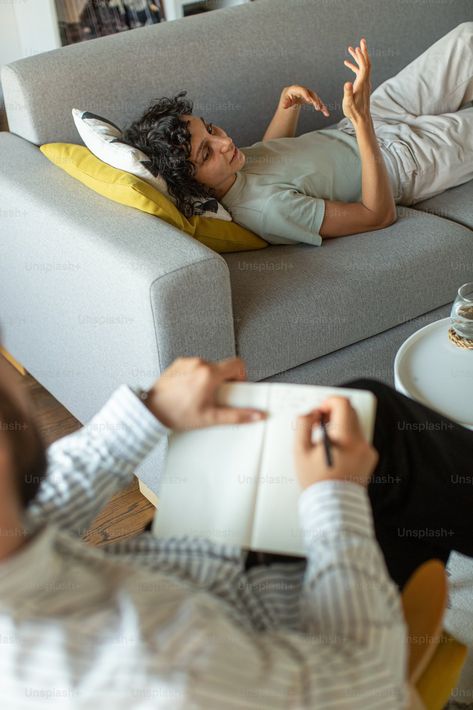 A man laying on top of a couch next to a woman photo – Therapist Image on Unsplash Therapist Couch, 1111 Portal, Therapist Photoshoot, Headshots Poses, Therapy Couch, Career Manifestation, Craniosacral Therapy, Goal Board, Woman Photo