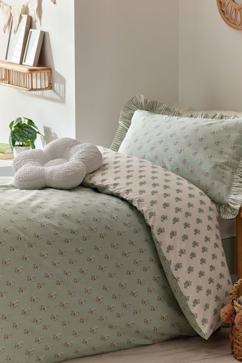 Drift off into a serene sleep with our pink printed polycotton duvet cover and pillowcase set. This supersoft bedding set is make with practical polycotton which ensures fast drying and minimal ironing. Coated in a stunning floral print with fun frill detailing on the pillowcases, this is one bedding set that is needed for your collection. Machine washable. Duvet Cover and Pillowcase:52% Recycled polyester,48% Cotton Green Bed Cover Ideas, Kids Green Bedding, Sage Green And Light Pink Bedroom Aesthetic, Gray And Sage Bedroom, Green And Pink Bedding, Pink And Green Bedding, Green Bed Covers, Pale Pink Bedrooms, Light Pink Bedrooms