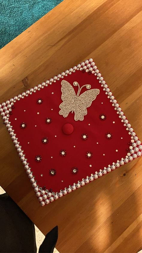 Jeweled Graduation Caps, Diamond Cap Graduation, Cap Decoration Graduation Butterfly, Pearl Grad Cap, Red Grad Cap Ideas, Red Graduation Cap Designs, Pearl Graduation Cap, Butterfly Graduation Cap, Red Graduation Cap